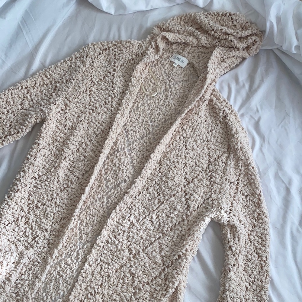 Long cream cardigan with pockets and a hood